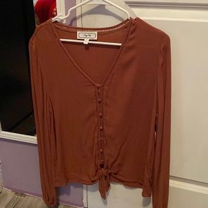 Tan/brown color, feels fresh, fits good as oversize.